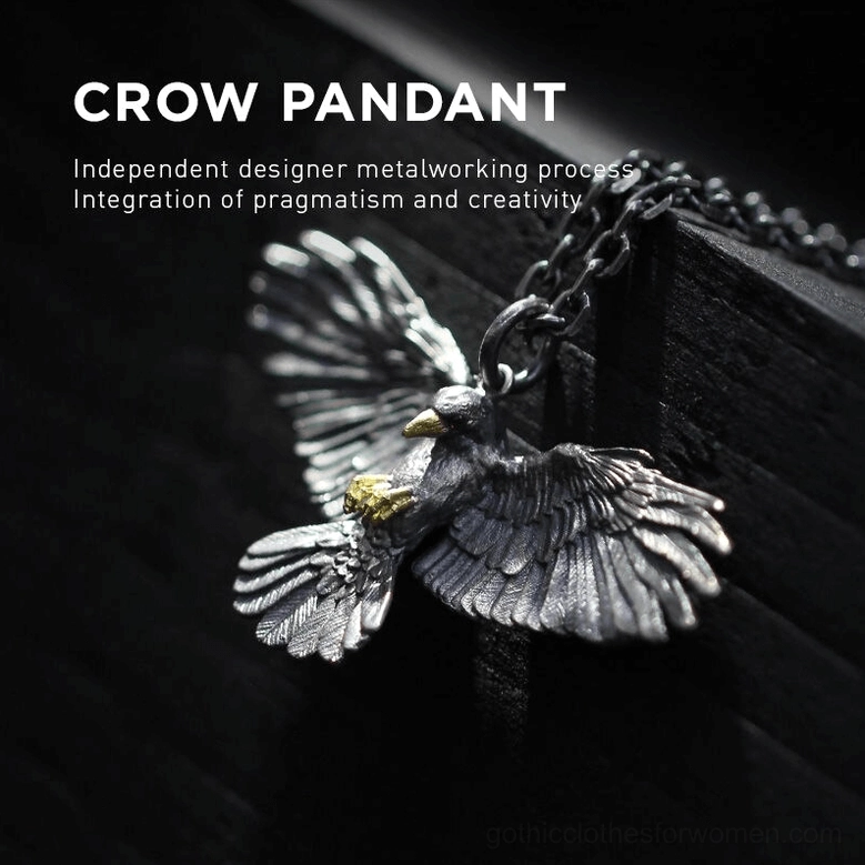 Vintage silver crow pendant necklace on dark wooden background showcasing artisanal metal craft and intricate design