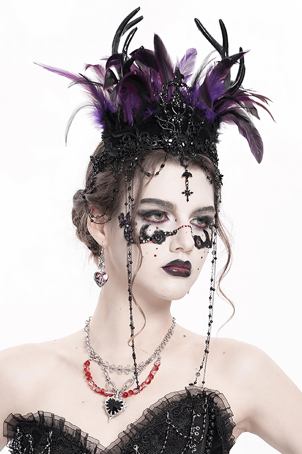 Alternative angle of feathered gothic crown with cross ornaments on female model with goth styling and dark aesthetic