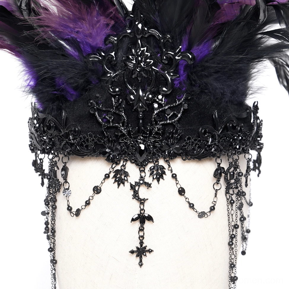 Close-up flat detail shot of gothic crown top with carved black metal decorative elements and black-purple feather accents