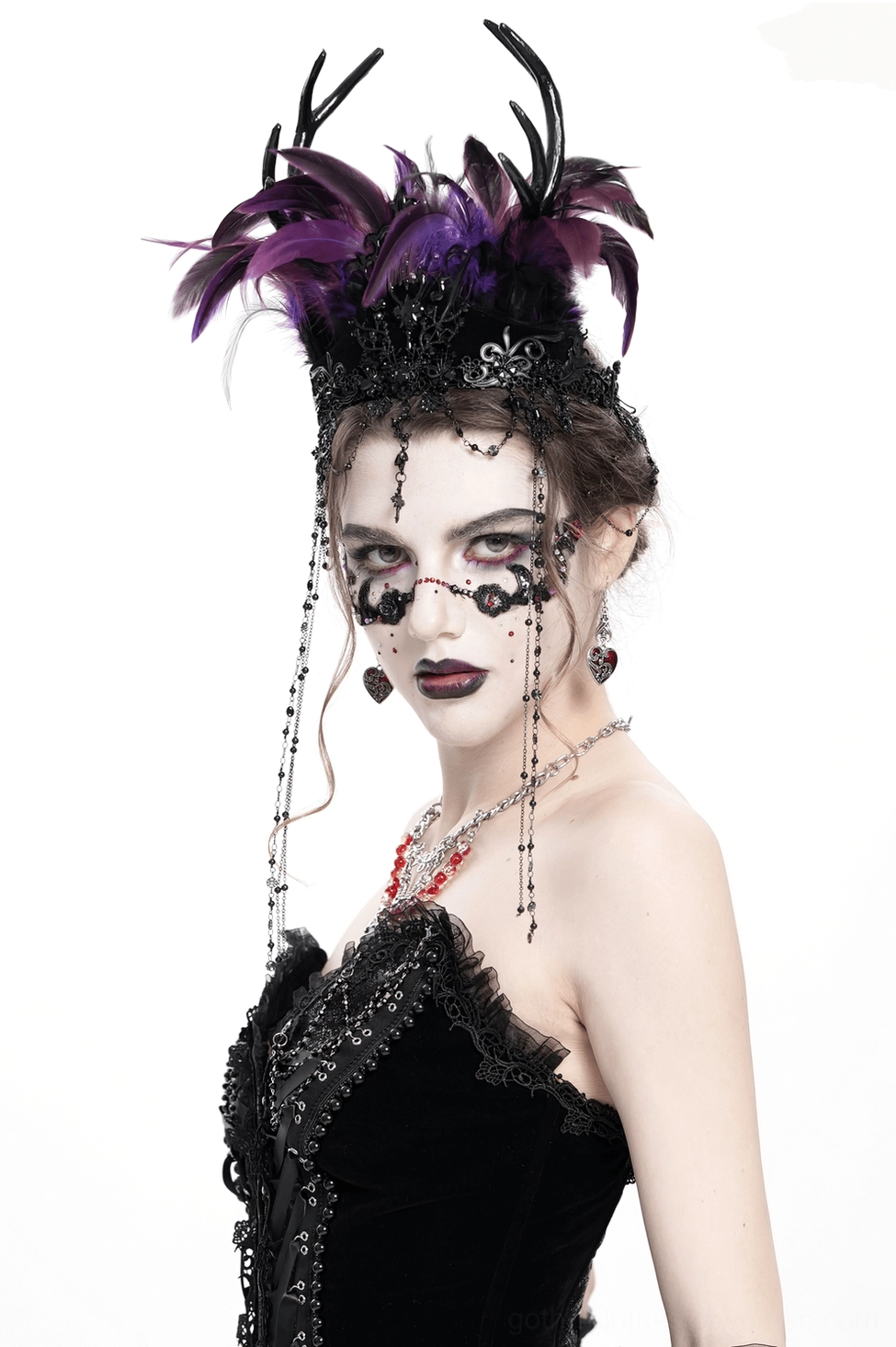 Three-dimensional view of gothic feathered headpiece showing depth of black-purple feathers and cross pendant arrangement