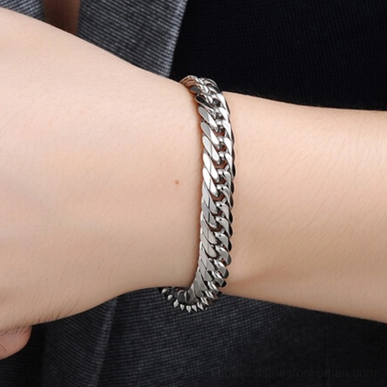 Gothic bracelet worn on male wrist showing natural fit and polished silver finish in realistic wear scenario