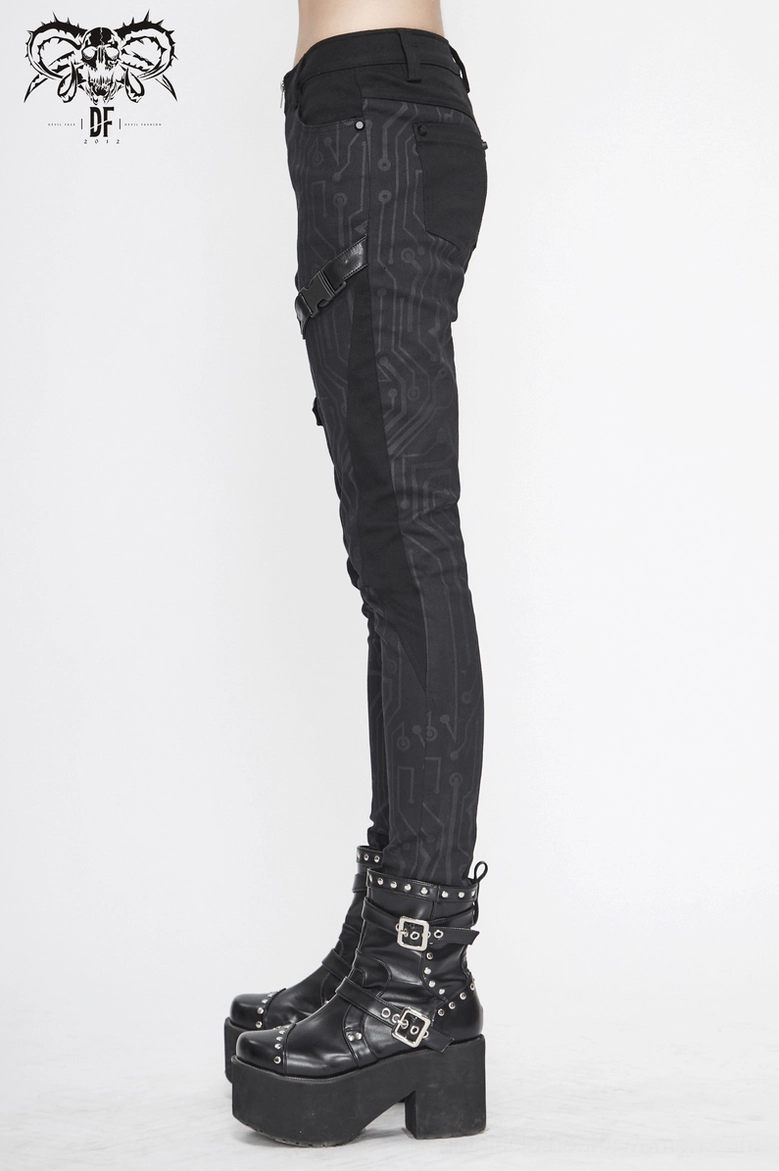 Complete styling view of black circuit board printed gothic cyberpunk skinny pants with boots