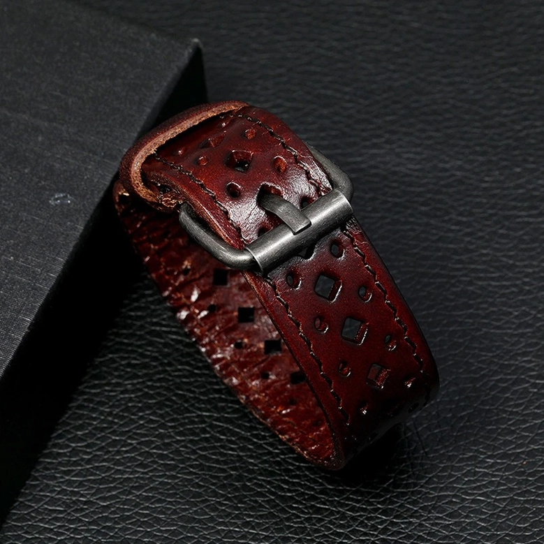 Dark brown vintage cowhide leather cuff bracelet with metal buckle fastening and display box, side angle shot