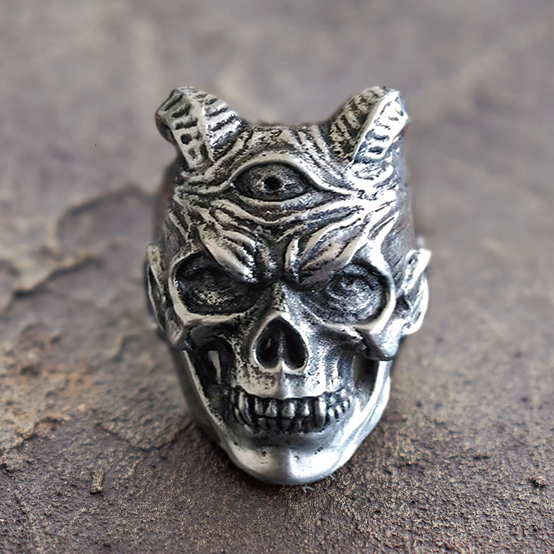 Demon skull gothic ring oblique angle view displaying third eye and distressed silver metal texture