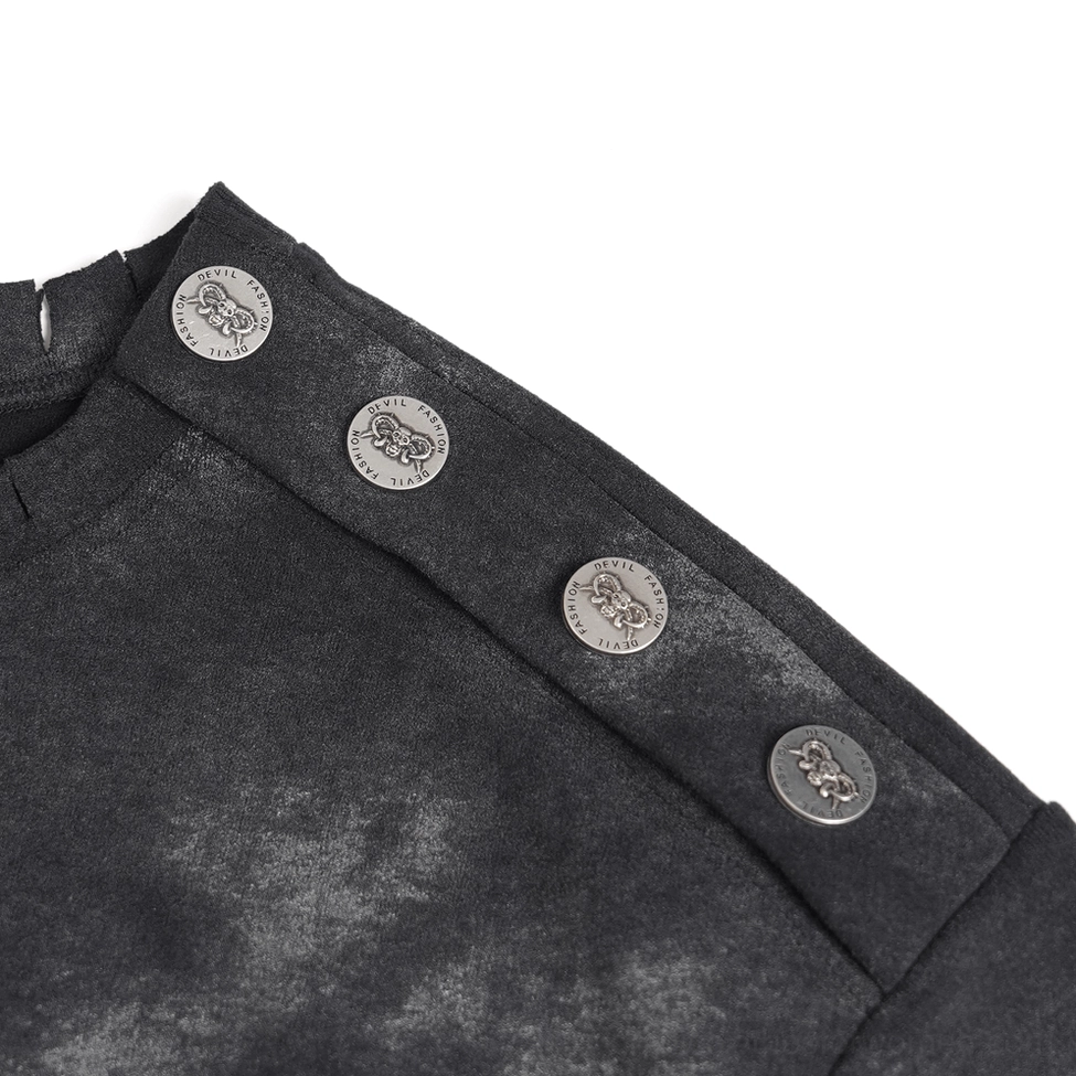 Close-up of distressed demon tee shoulder panel featuring decorative metal snap buttons and faded tie-dye wash