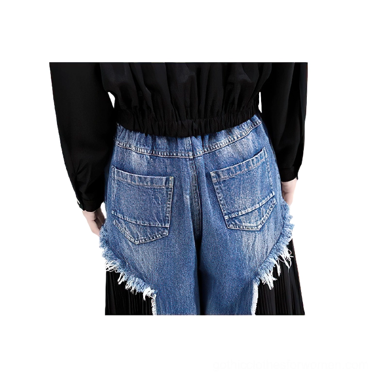 Close-up detail of gothic denim trousers back pocket showing frayed distressed edges and construction quality