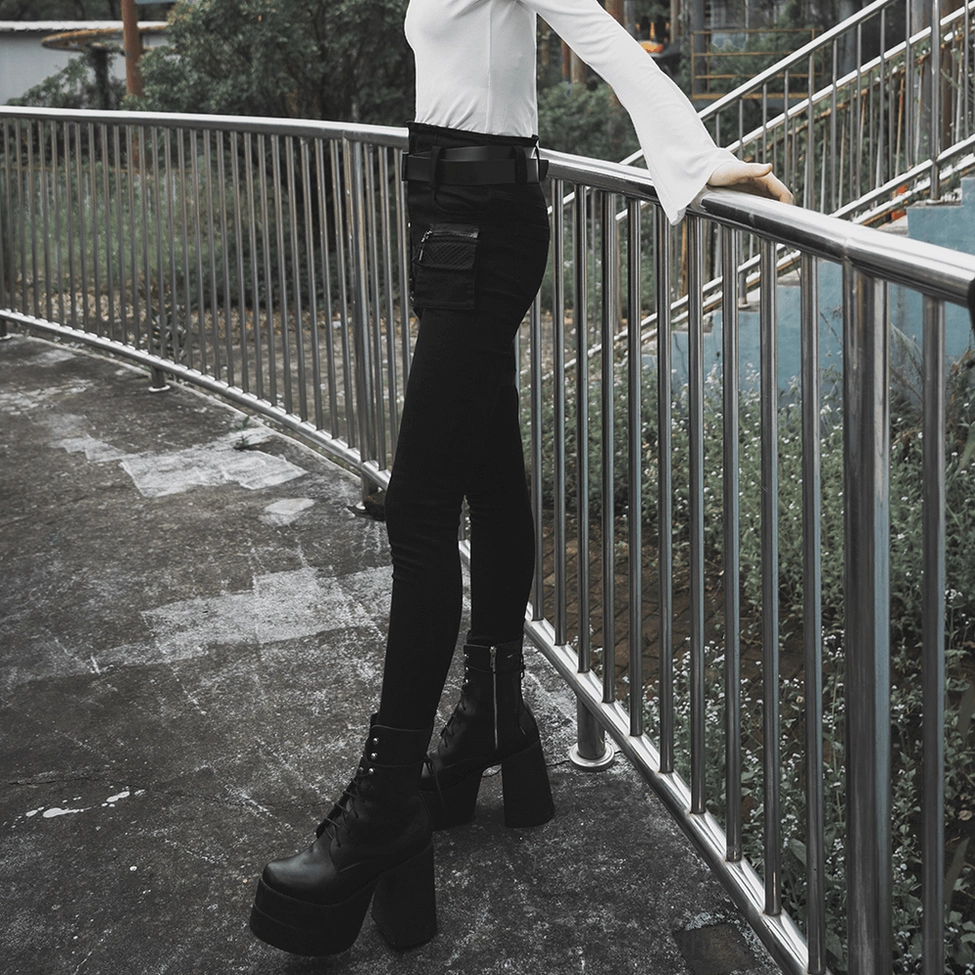 Black gothic slim denim jeans with all detachable straps and belt system intact on white background