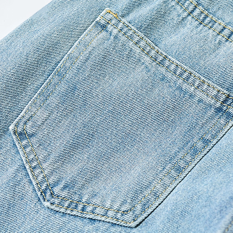 Gothic denim jeans structural design showing asymmetric waistband architecture and professional construction