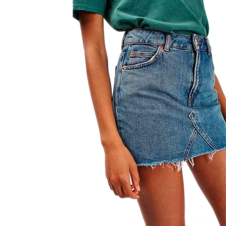 high-waist gothic denim mini skirt with raw frayed hem and front pockets front view on model