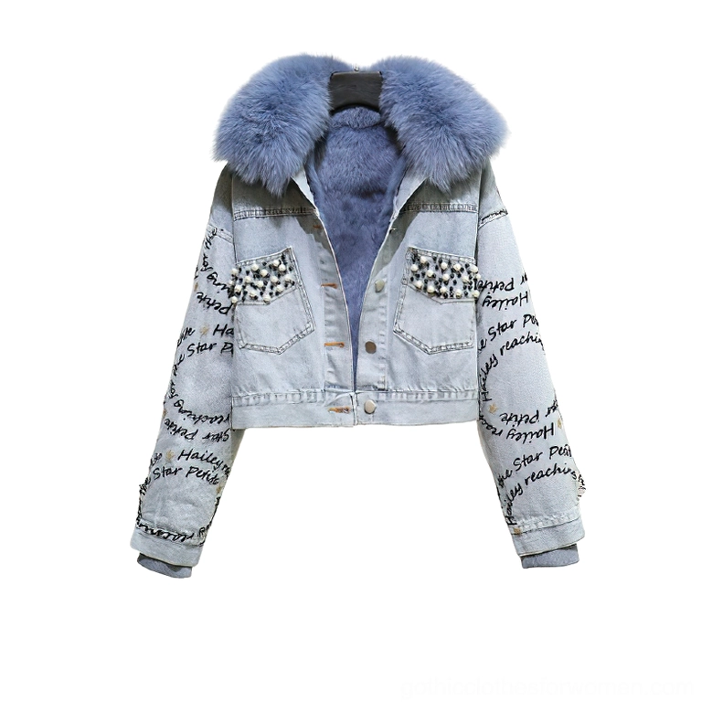 Blue gothic denim parka with light blue fox fur collar and pearl beaded pocket details, front flat lay view