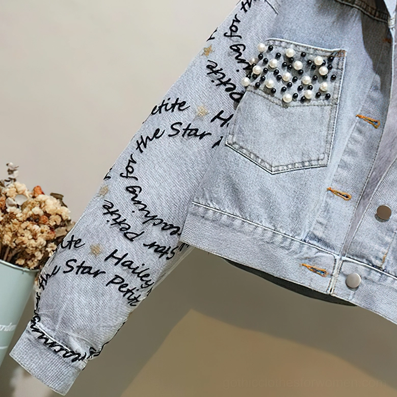 Gothic beaded denim parka featuring letter embroidery, pearl pocket details, and luxurious fur collar trim