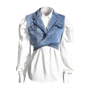 Gothic denim wrap vest with puff sleeve white shirt front view on dress form, asymmetrical cropped silhouette