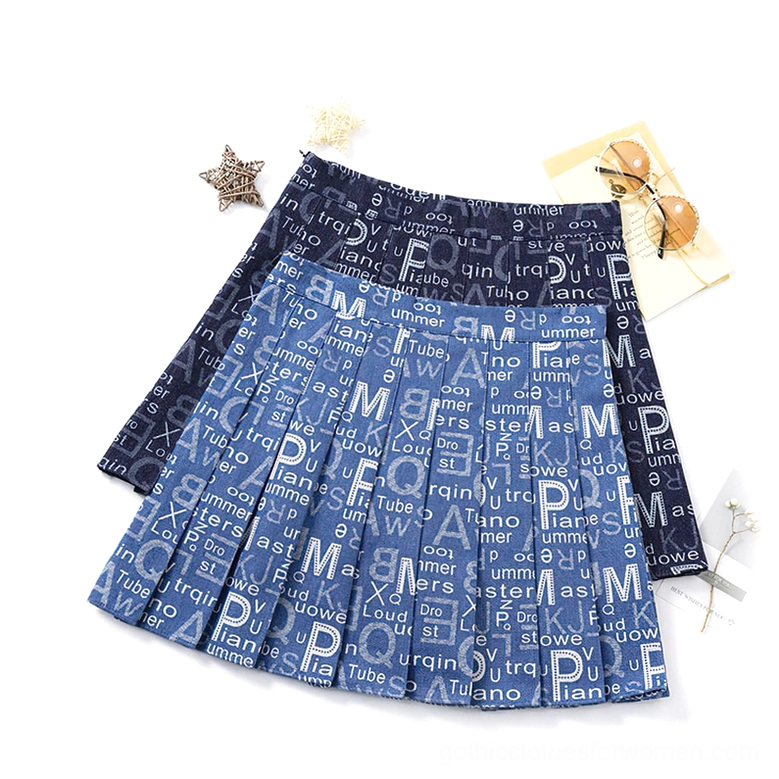 Two letter print pleated denim mini skirts top-down flat lay, cobalt and navy colorways, alternative fashion styling