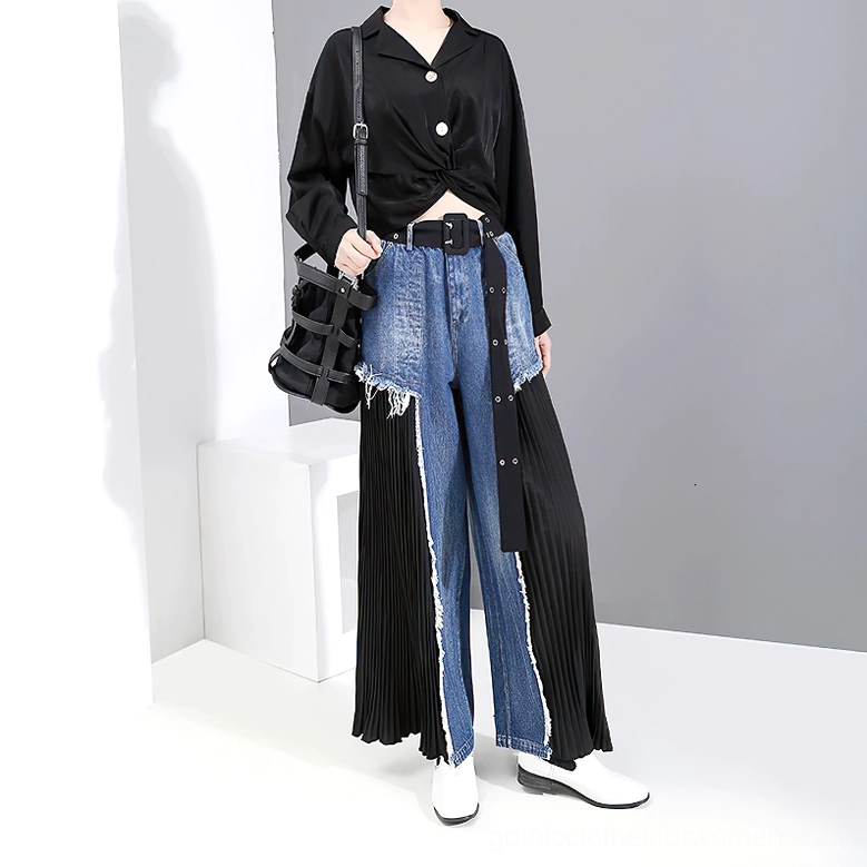Side profile of gothic high-waist denim trousers worn with wide leather belt and white leather shoes, demonstrating silhouette and proportions