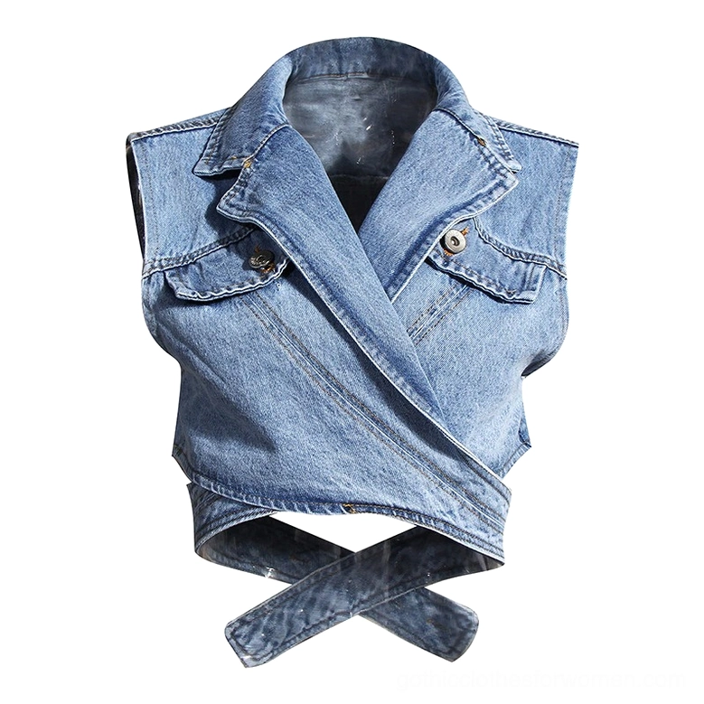 Cropped gothic denim wrap vest close-up detail showing notched lapel, flap pockets, and structured tailoring