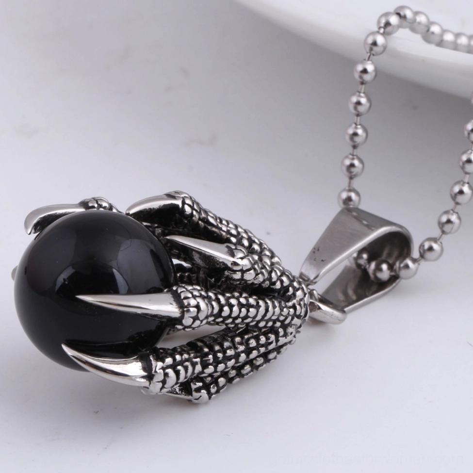 Black crystal dragon claw gothic necklace oblique view with stainless steel chain and clasp visible