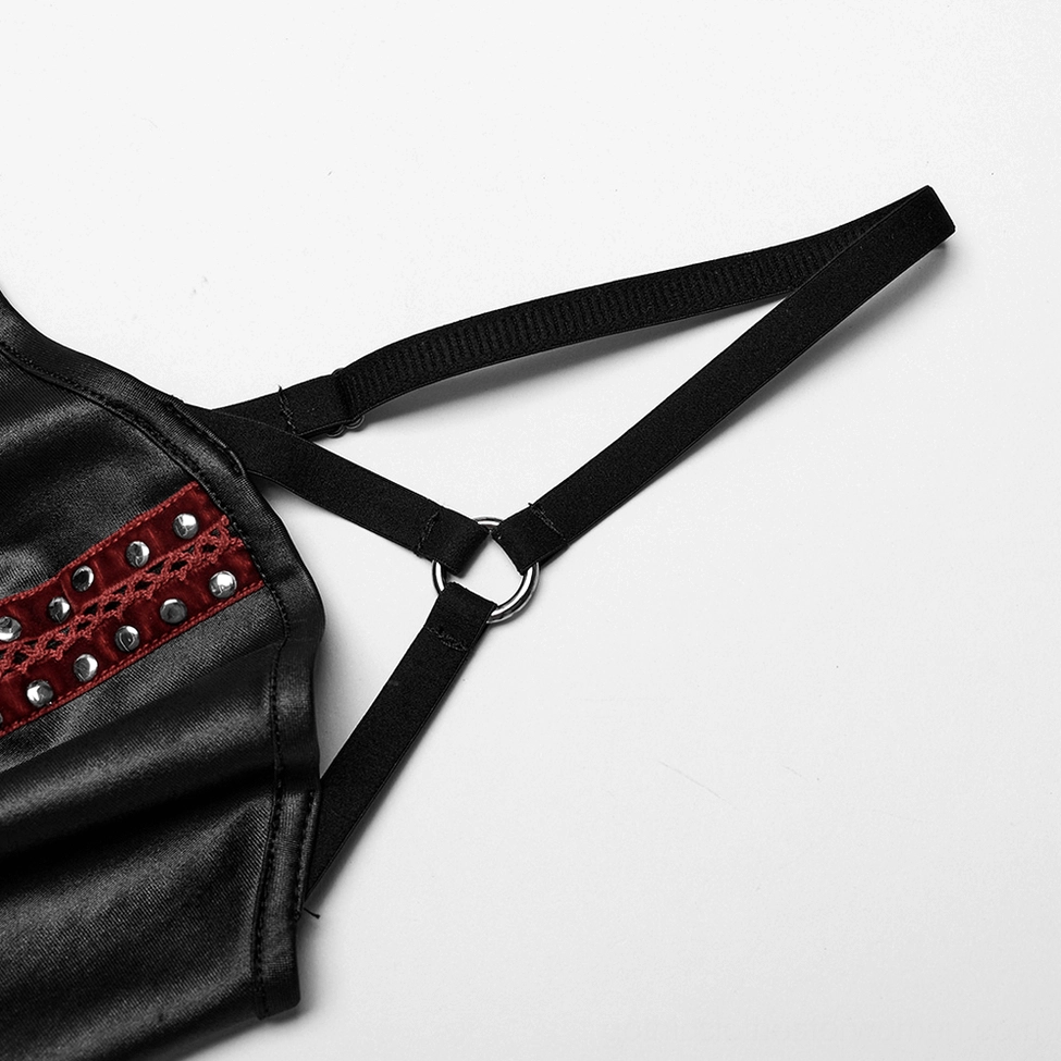 Close-up detail of adjustable metal O-ring strap hardware with red studded rivet trim
