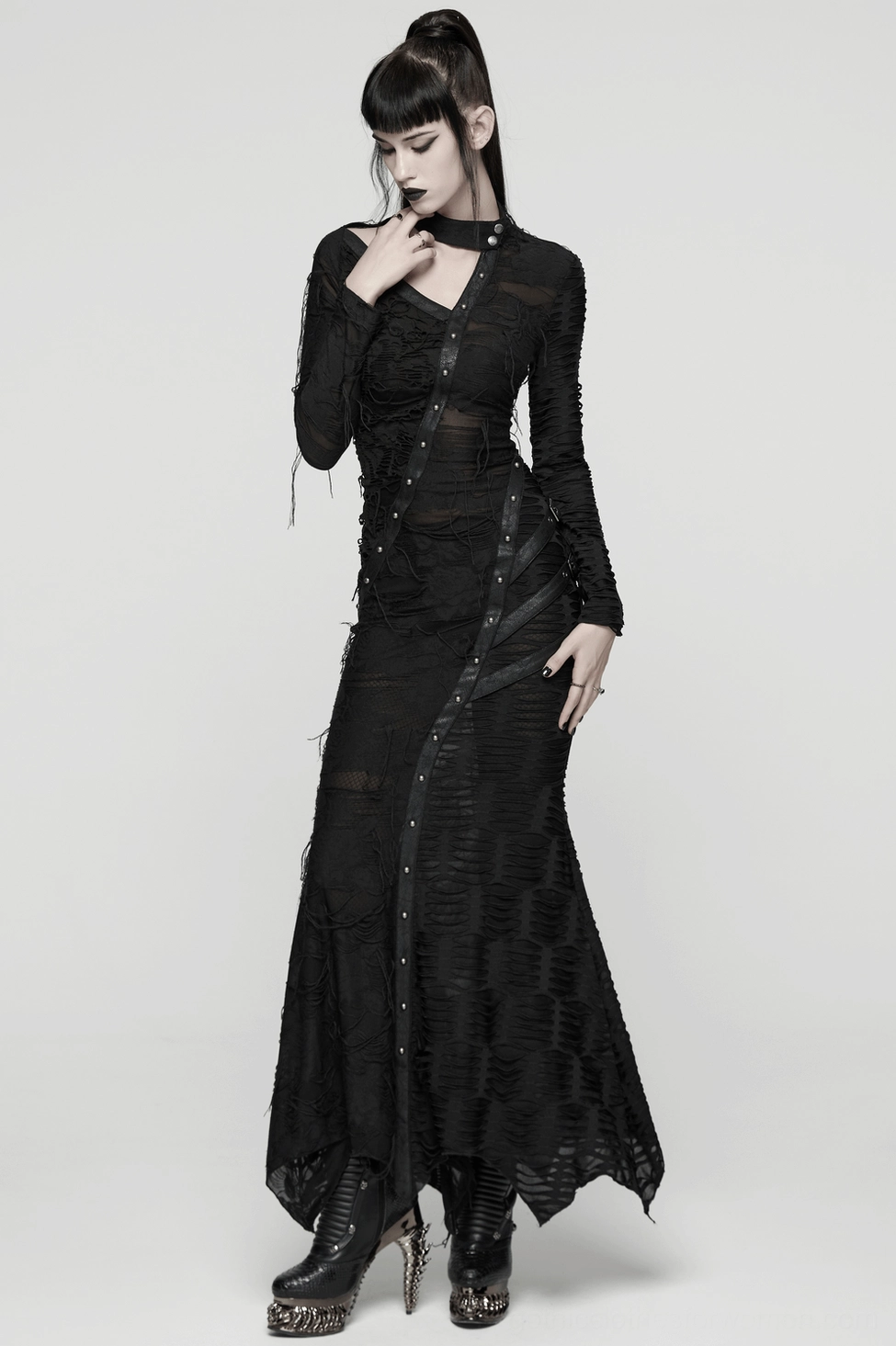 Black gothic maxi dress detail view emphasizing asymmetric cut and distressed fabric aesthetic