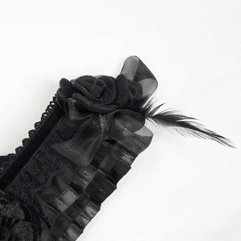 Model in black gothic dress three-quarter back view highlighting crisscross lace-up corset design and dress drape