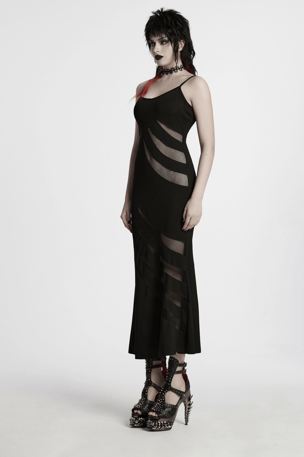 Back view detail of gothic dress showing lace-up corset construction and flowing fishtail hemline