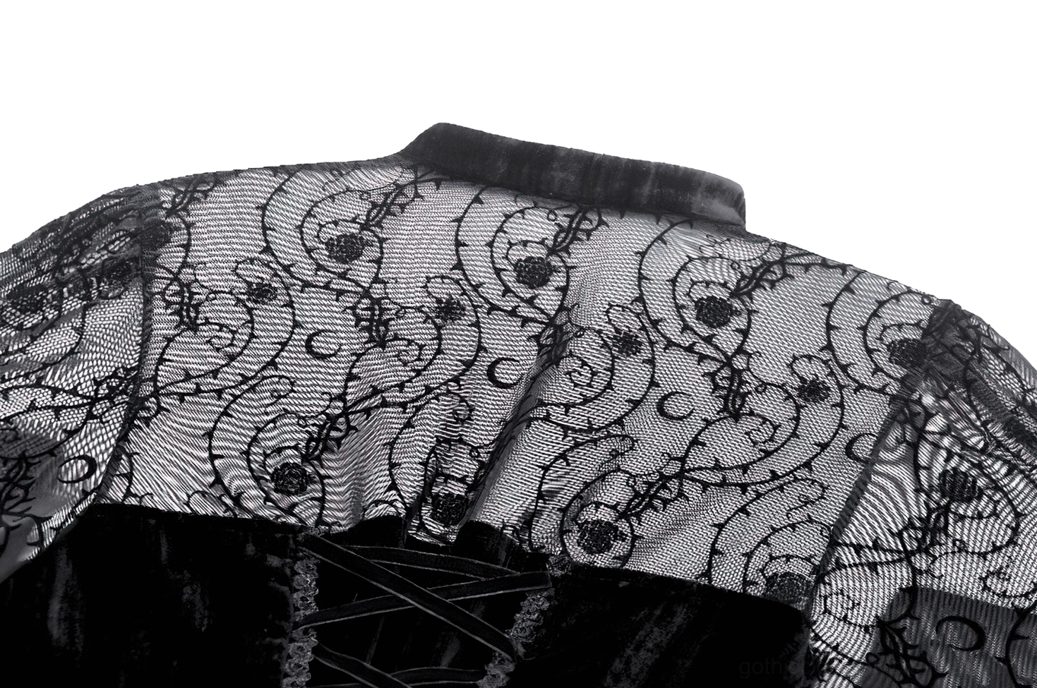 Back detail of gothic dress showing ornate scrollwork lace pattern and corset lace-up closure