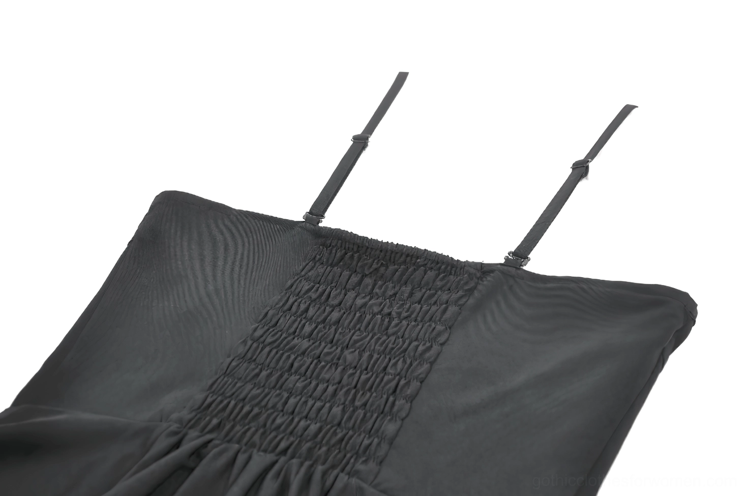 Back panel close-up of black gothic dress showing shirred elastic construction and adjustable spaghetti strap attachment on dark background