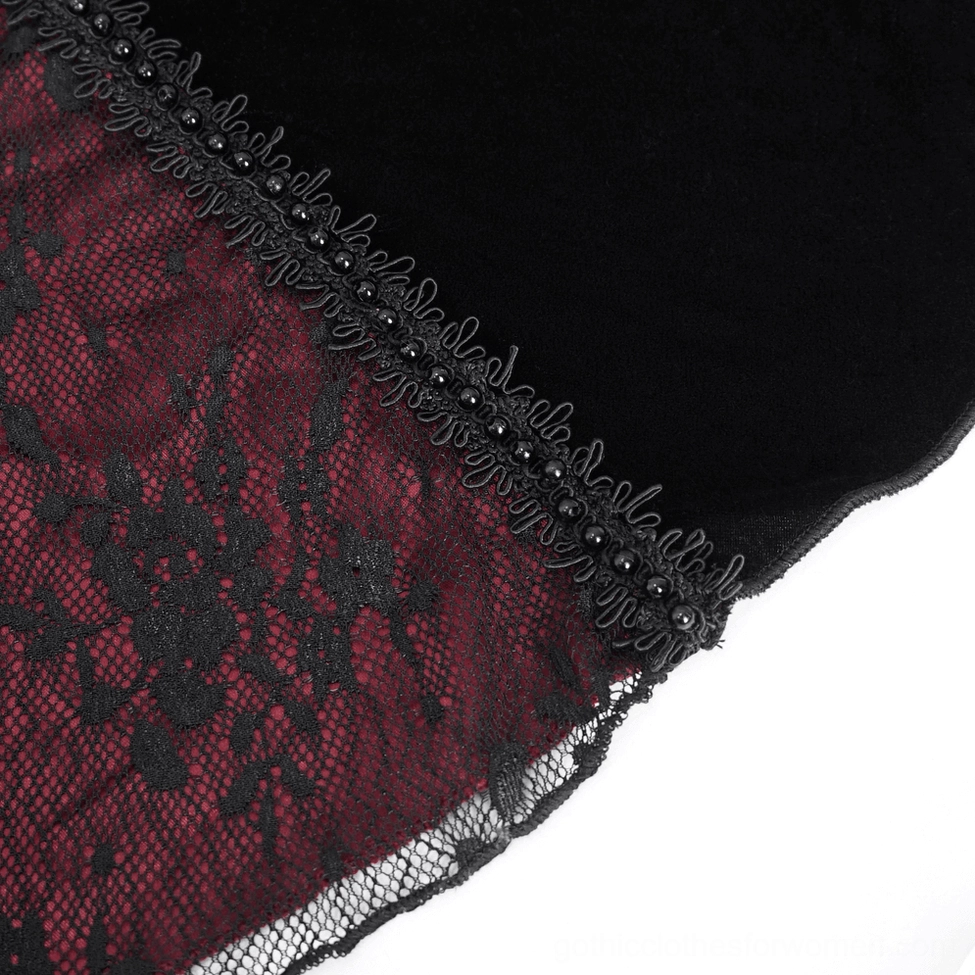 Close-up of black beaded lace edge trim on gothic velvet mermaid dress seam