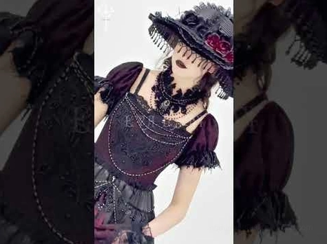 Close-up detail views of gothic dress showing intricate beaded trim, ornate lace-up neckline closure, and rich burgundy patterned fabric texture