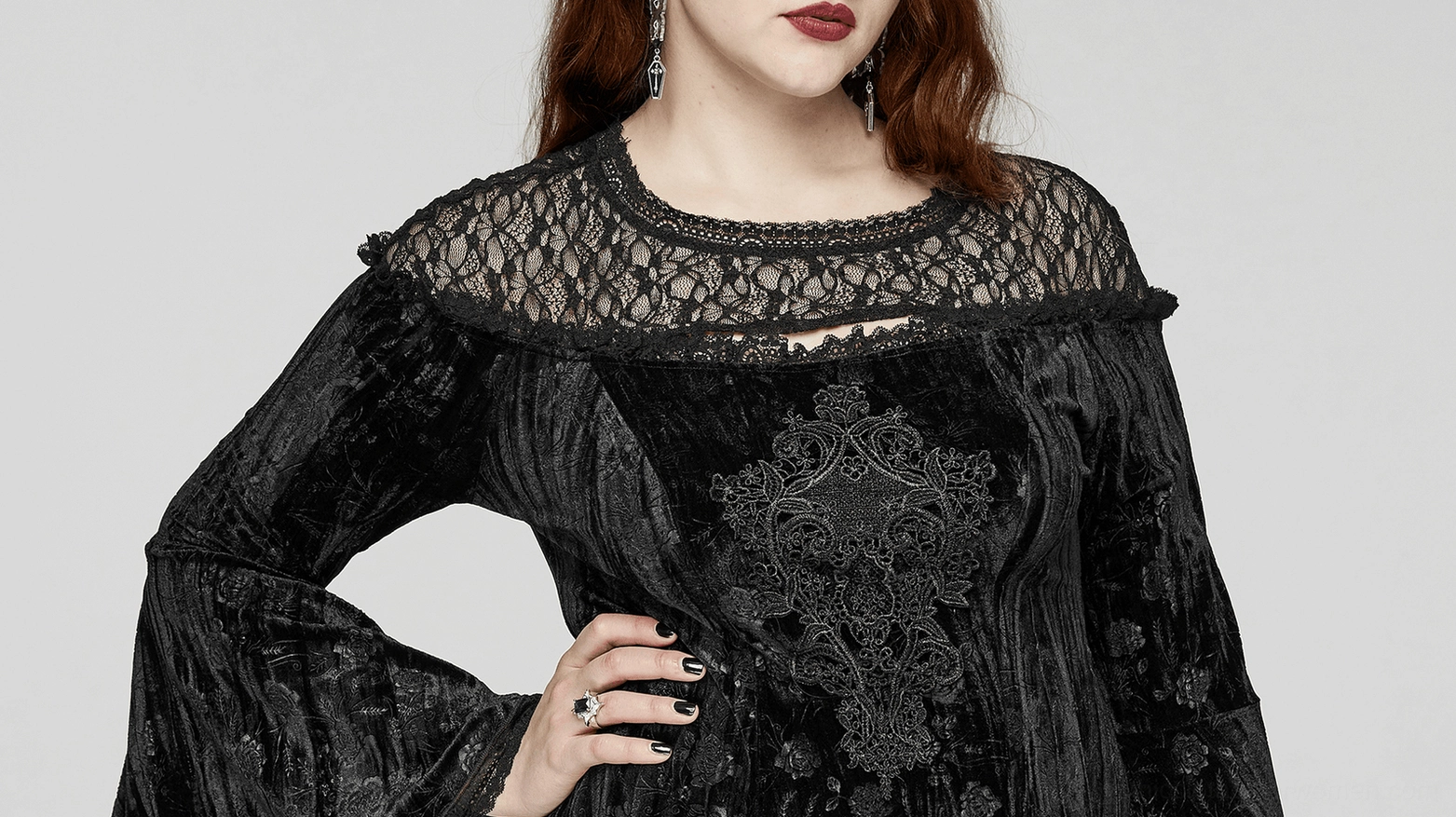 Black velvet rose gothic dress sleeve detail showcasing dramatic bell sleeve trumpet cuff and architectural design