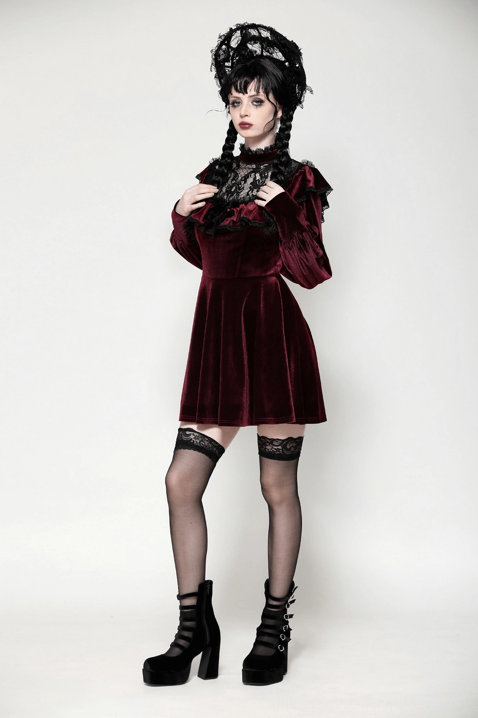 Black lace ruffles and velvet bow accent on gothic mini dress neckline