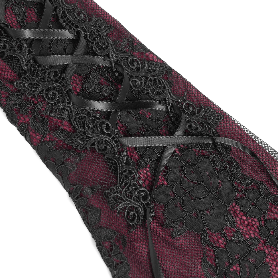 Detailed close-up of black satin ribbon lacing on gothic dress lace-up corset elements showing craftsmanship