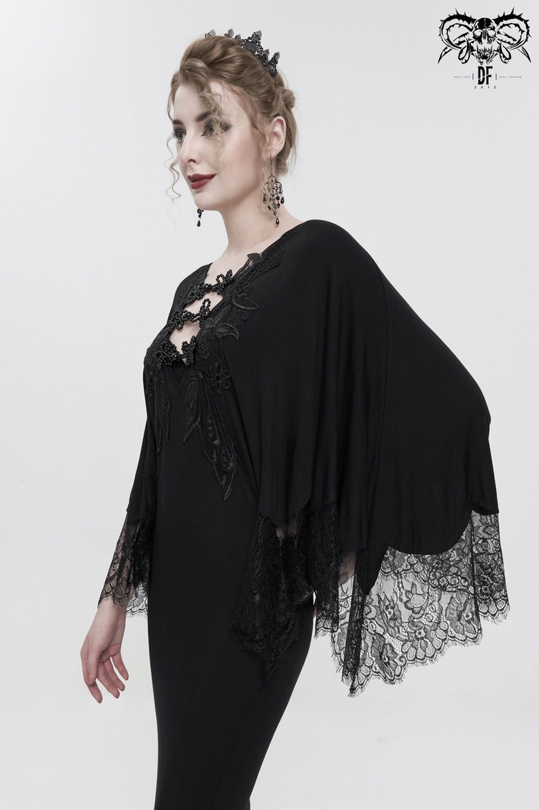 Black gothic mermaid dress bodice and chest detail, showing beaded lace applique work and front silhouette design