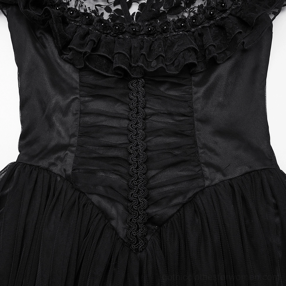 Close-up of black gothic dress bodice - ruched satin fabric with lace trim and mesh overlay