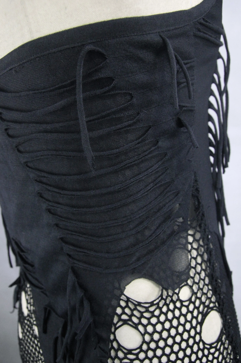 Close-up of black gothic dress bodice showing slashed frayed fabric and ruched details