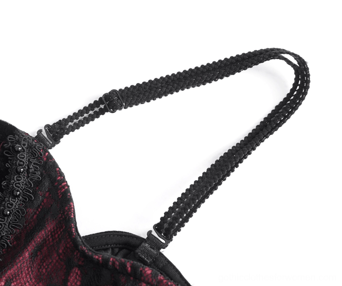 Close-up of braided black spaghetti strap with beaded lace trim detail on gothic dress
