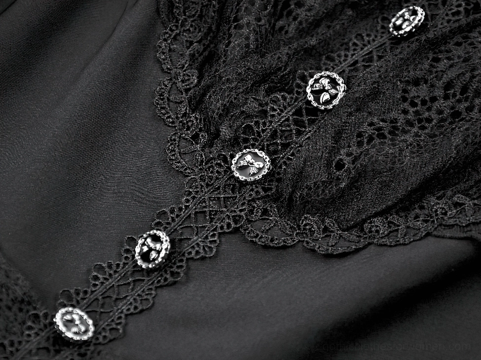 Detailed close-up view of ornate silver buttons and delicate lace trim on black gothic dress