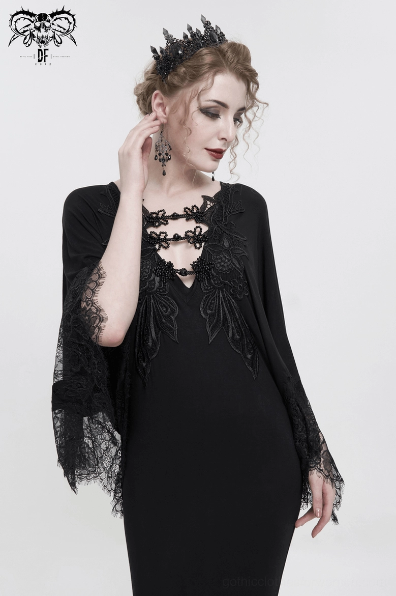 Black gothic mermaid dress detail shot showing lace-trimmed cape sleeve cuff and delicate fringed edge embellishment