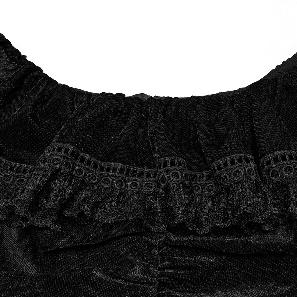 Gothic dress collar ruffle detail close-up showing lace trim and embroidered edge on black velvet