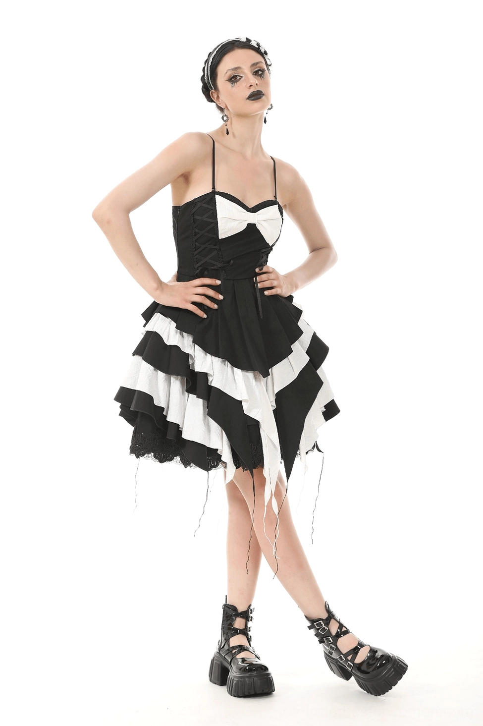 Black and white gothic dress detail showing corset-style bodice construction and lace accents