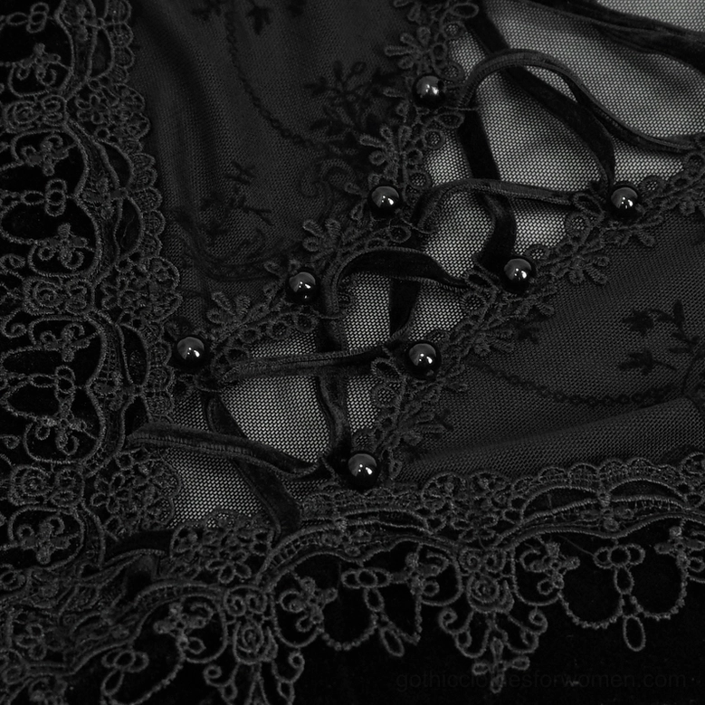 Close-up of Gothic dress corset bust detail showing lace-up design with black bead buttons and floral lace trim