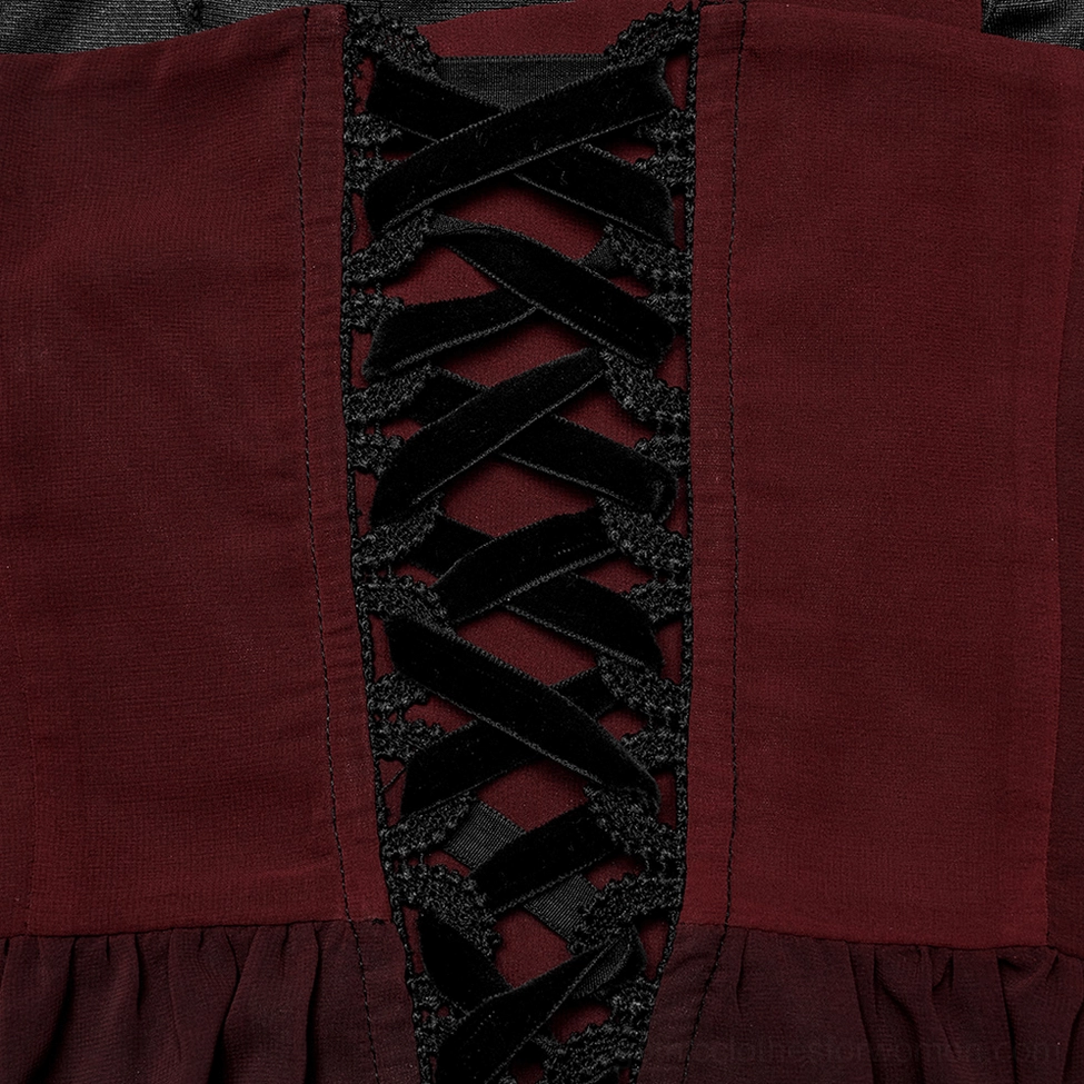 Back closure detail showing velvet ribbon corset lace-up on burgundy bodice fabric