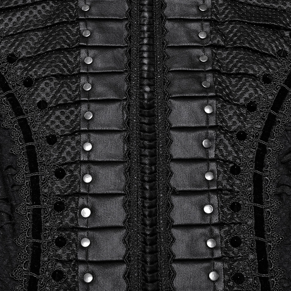 Macro detail of dress front corset showing pleated fabric structure, metal studs arrangement, and distressed mesh texture against dark background