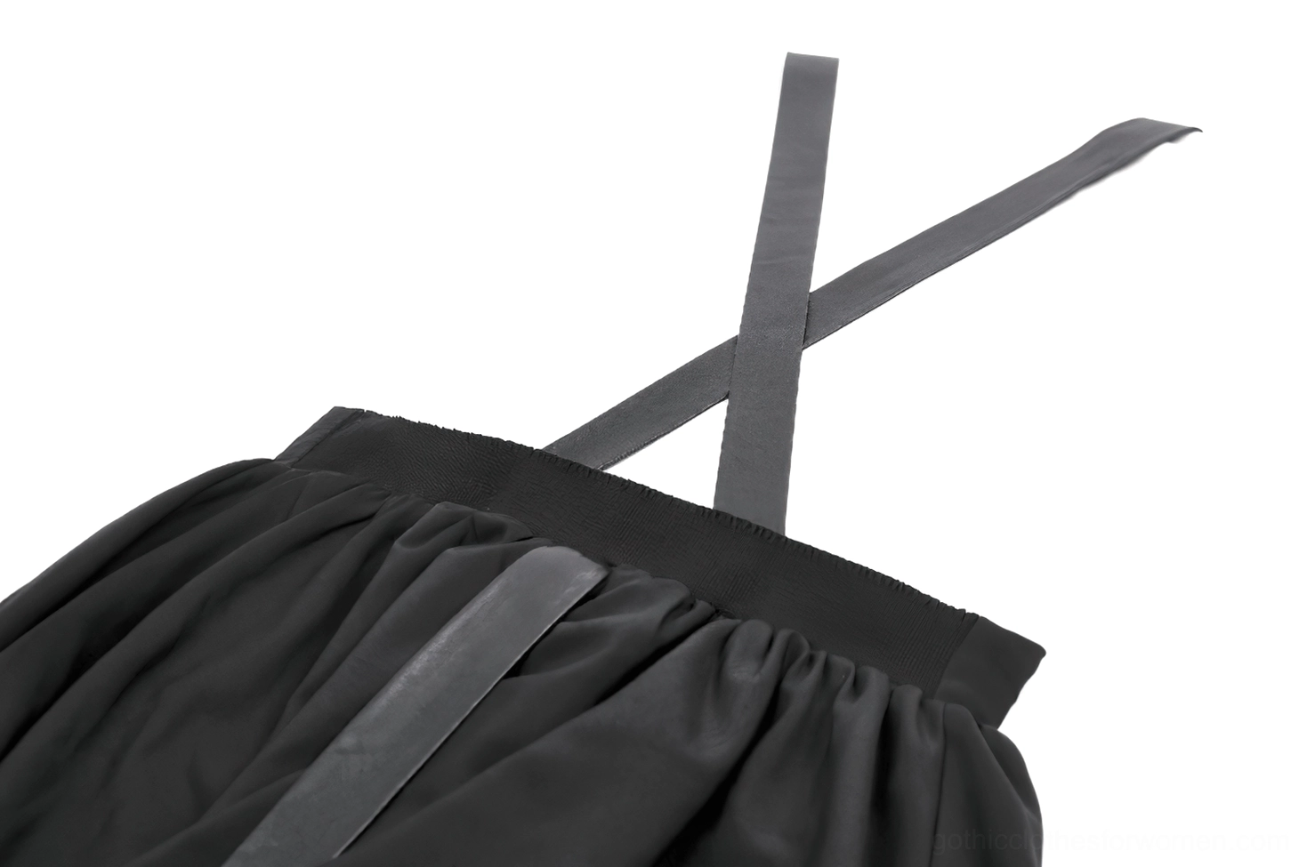 Side close-up of gothic dress cross-back straps with elastic waist and heart-shaped tail attachment