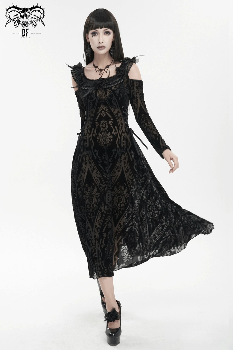Close-up detail view of black gothic dress showing damask pattern, semi-transparent fabric, and ruffled neckline construction