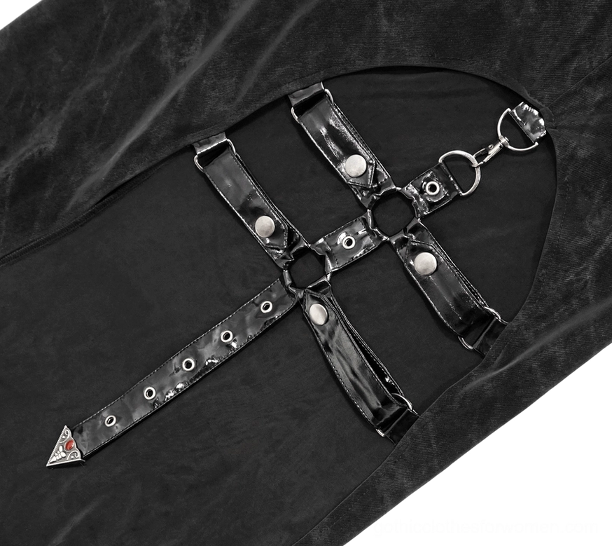 Close-up detail of gothic dress showing black velvet fabric with cross leather straps, metal rings and rivets