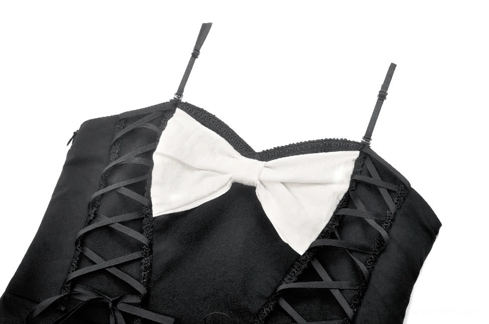 Close-up detail of black and white gothic dress white bow and ribbon lace-up trim at bust