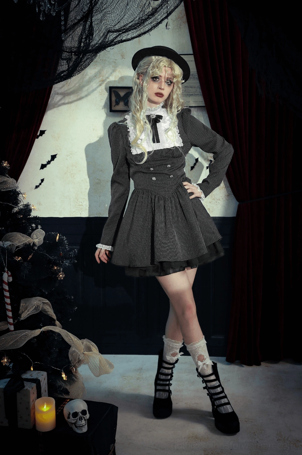 Black pinstripe gothic dress dramatic angle emphasizing romantic double-breasted silhouette and romantic details