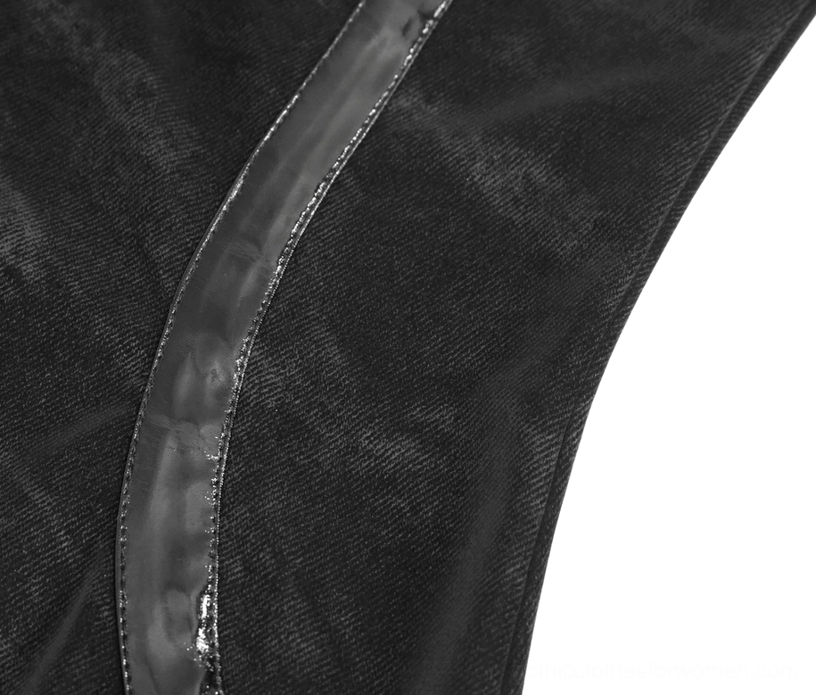 Close-up texture detail of black velvet fabric with patent leather stripe trim showing matte and glossy contrast
