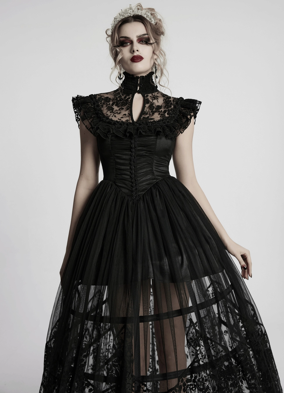 Black gothic dress texture close-up - layered mesh and satin materials with delicate floral lace