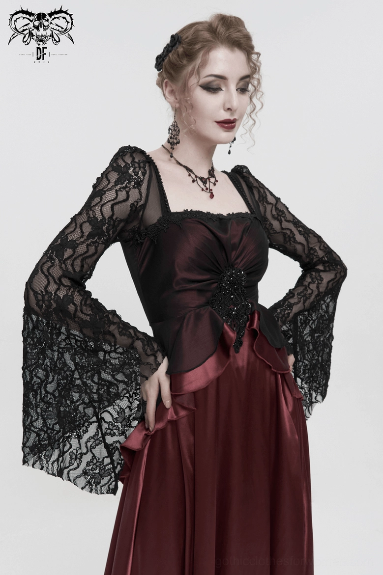 Close-up of wine red gothic dress fabric texture, showing satin and lace combination